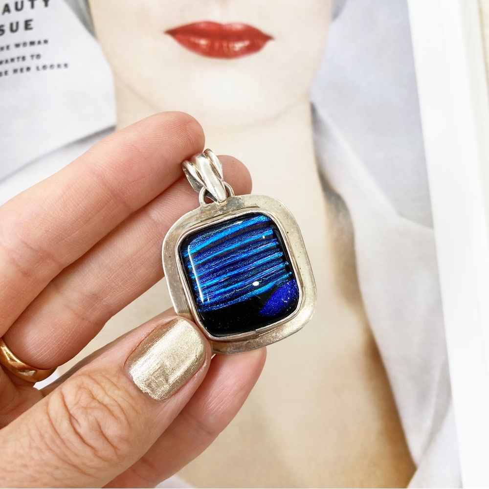 Sterling silver luminous blue glass chunky square pendant.
